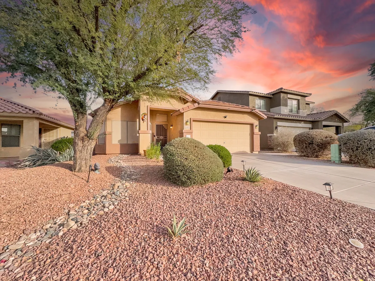 This exterior image showcases the home's front porch, a beautifully landscaped yard, and a welcoming entryway with a decorative wreath. The scene hints at the pleasant, walkable neighborhood and the inviting outdoor spaces that guests and their pets can enjoy.